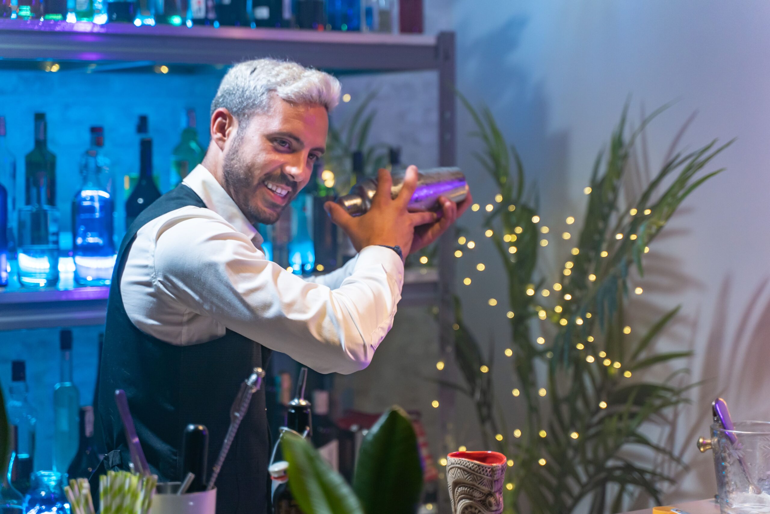 professional-bartender-in-a-white-shirt-and-black-2023-11-27-05-09-30-utc-min